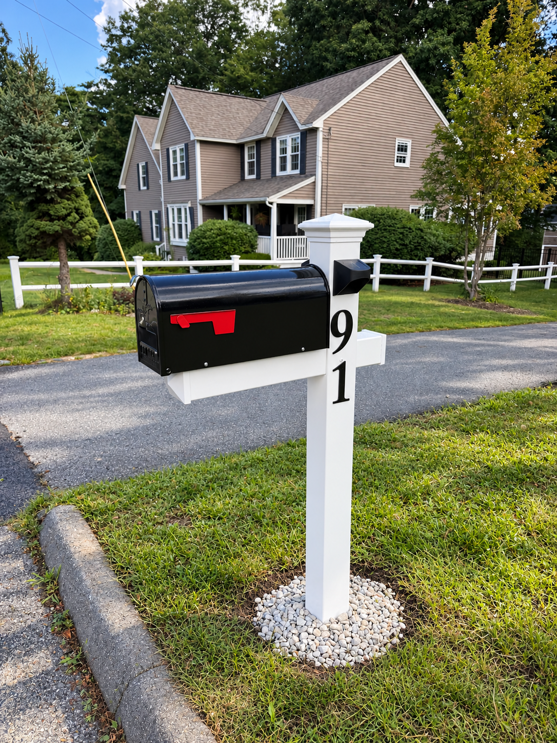 After: New white vinyl mailbox post with a black mailbox, house number 91, solar light, and a white stone base